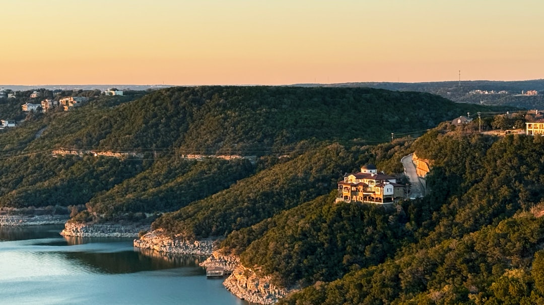 Naples waterfront estate dock and outdoor living area with native coastal planting