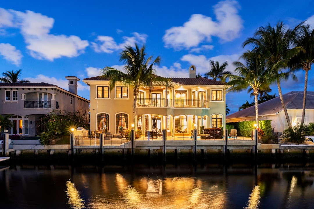Naples waterfront estate dock access path and seawall cap with porcelain hardscape