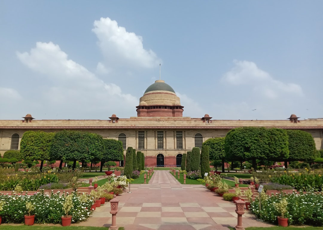 Formal estate garden with bilateral symmetry, clipped hedges, and stone pathway