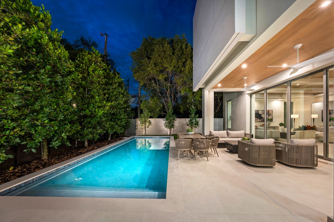 Contemporary outdoor pool with geometric hardscape and minimal architectural planting