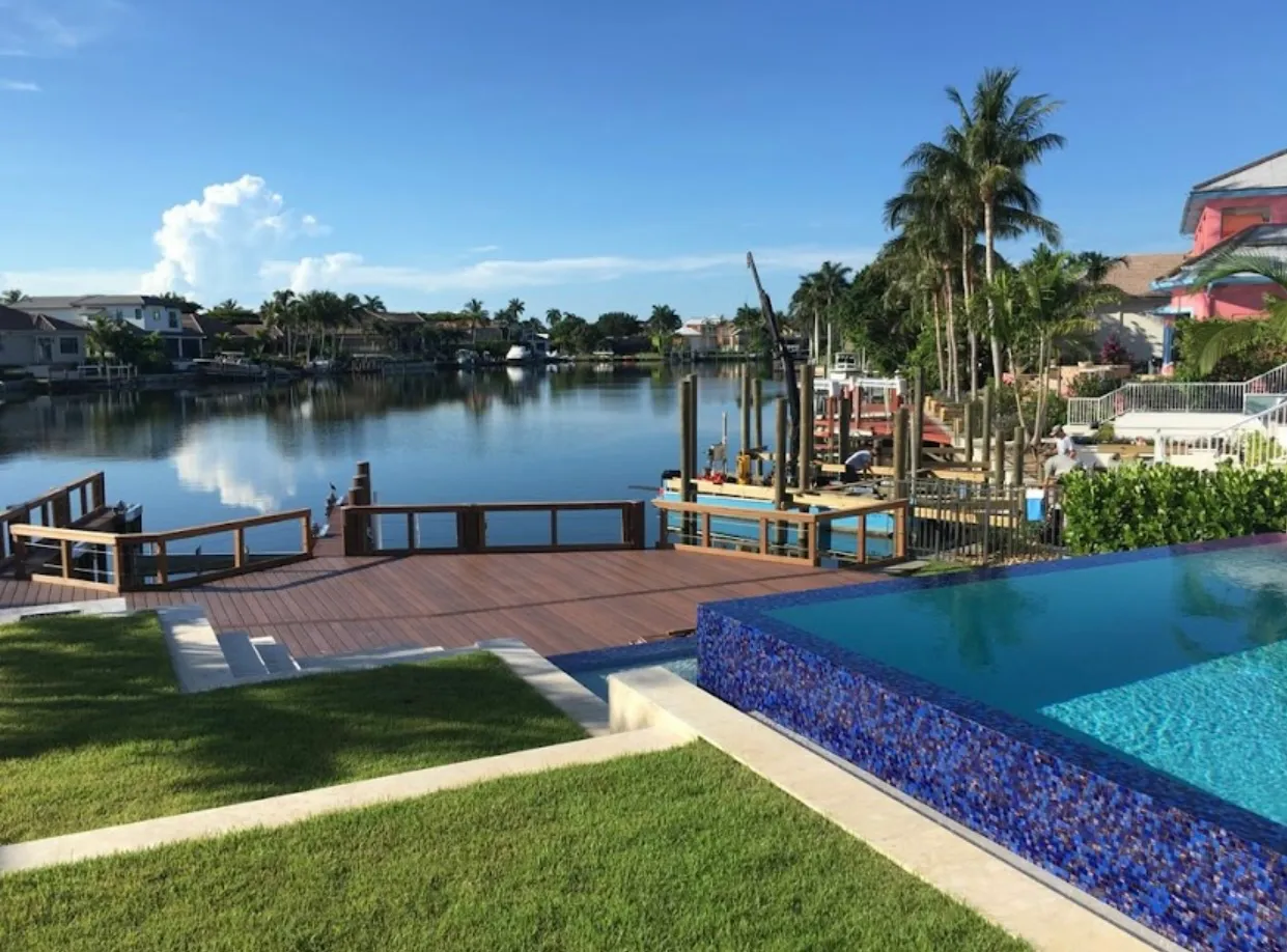Southwest Florida waterfront estate — pool, hardscape, and waterway context, Naples FL