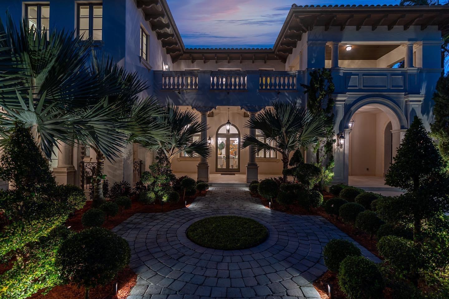 Naples estate outdoor lighting and entertainment — evening poolside environment