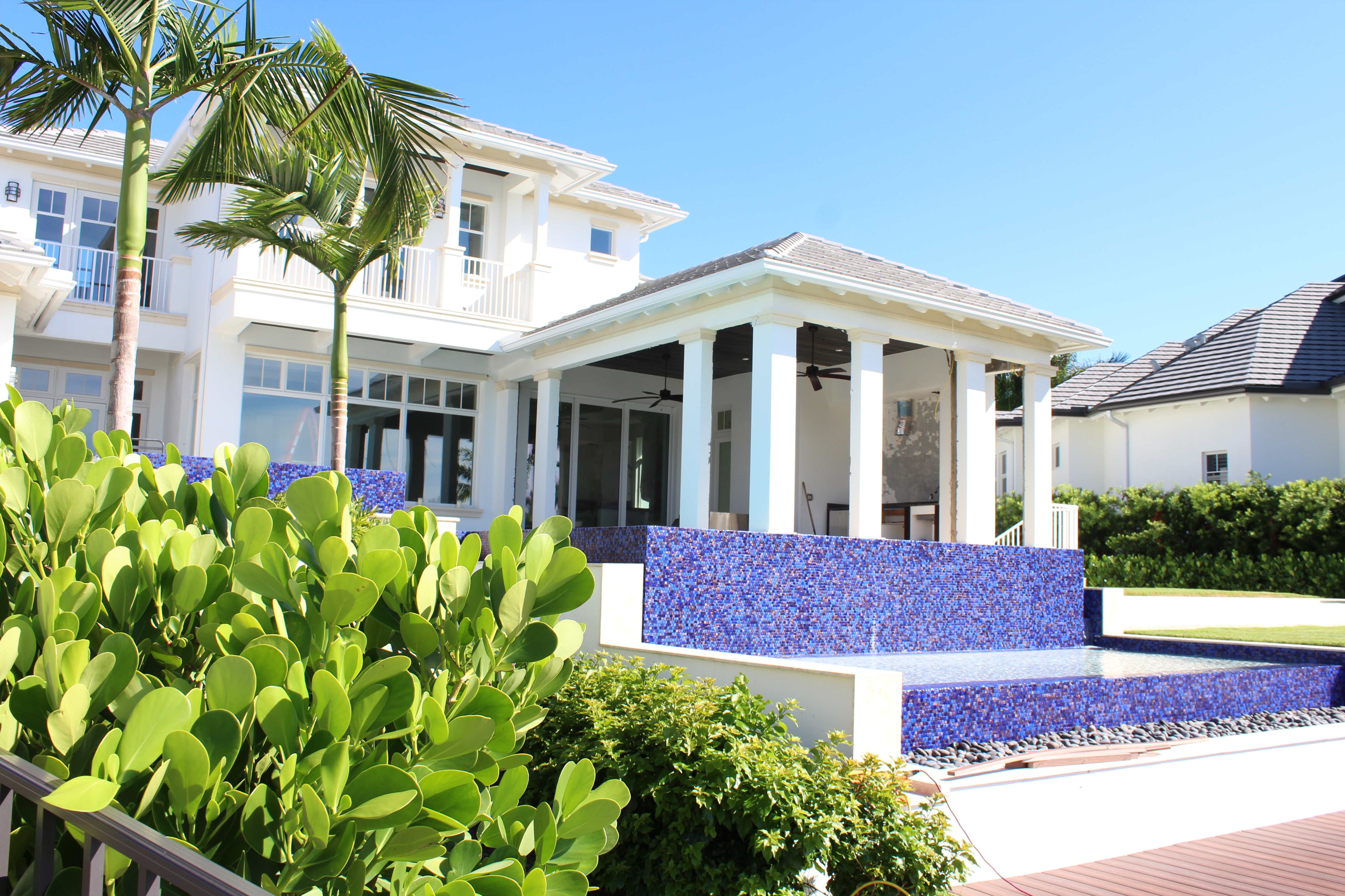 Naples outdoor kitchen and entertainment build — marine-grade stainless grill island