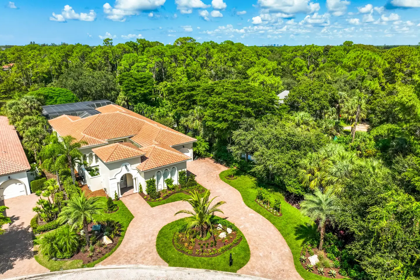 Mediterra estate aerial overview — full motor court, circular driveway, and planting, North Naples