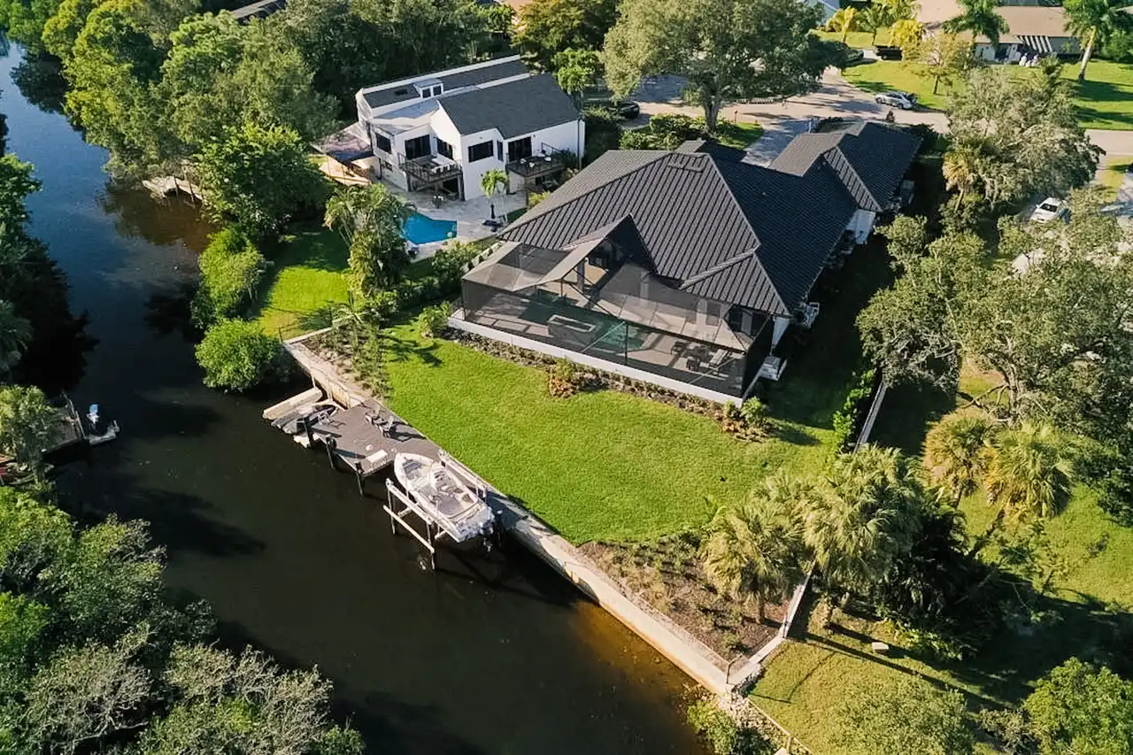 Waterfront aerial of Naples estate build by Precision Landscaping and Design